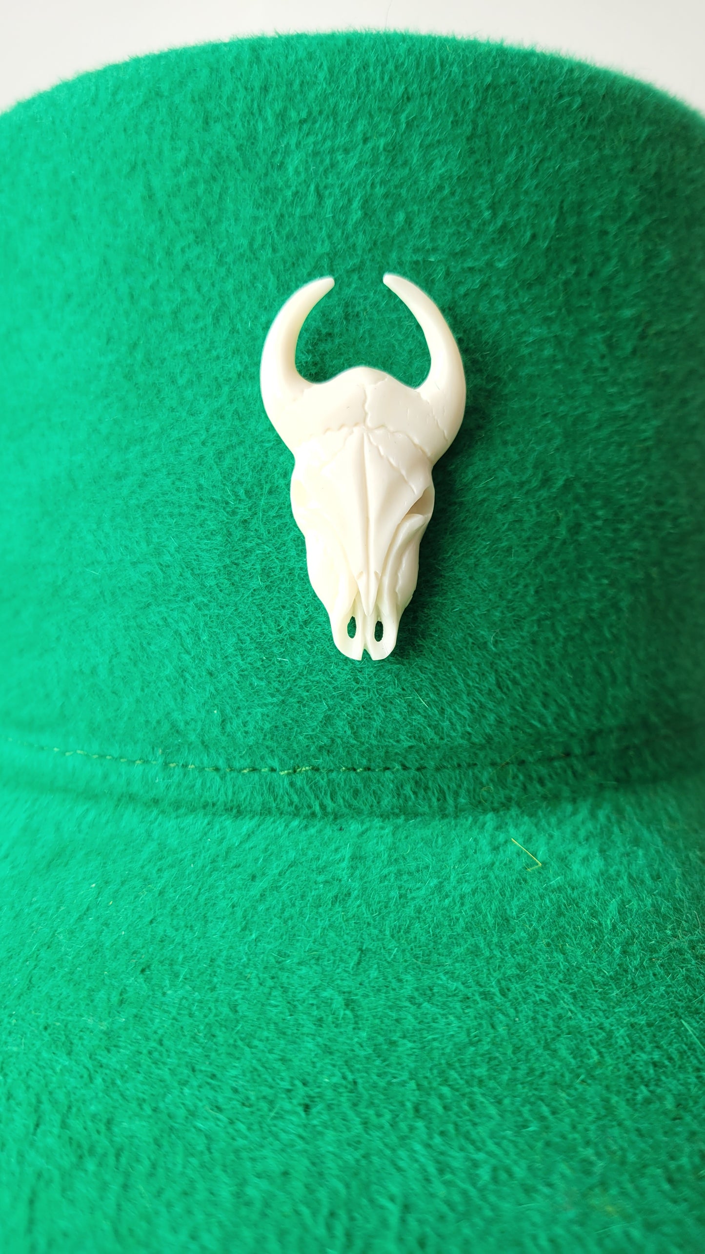 The Rhea Cap in grass green