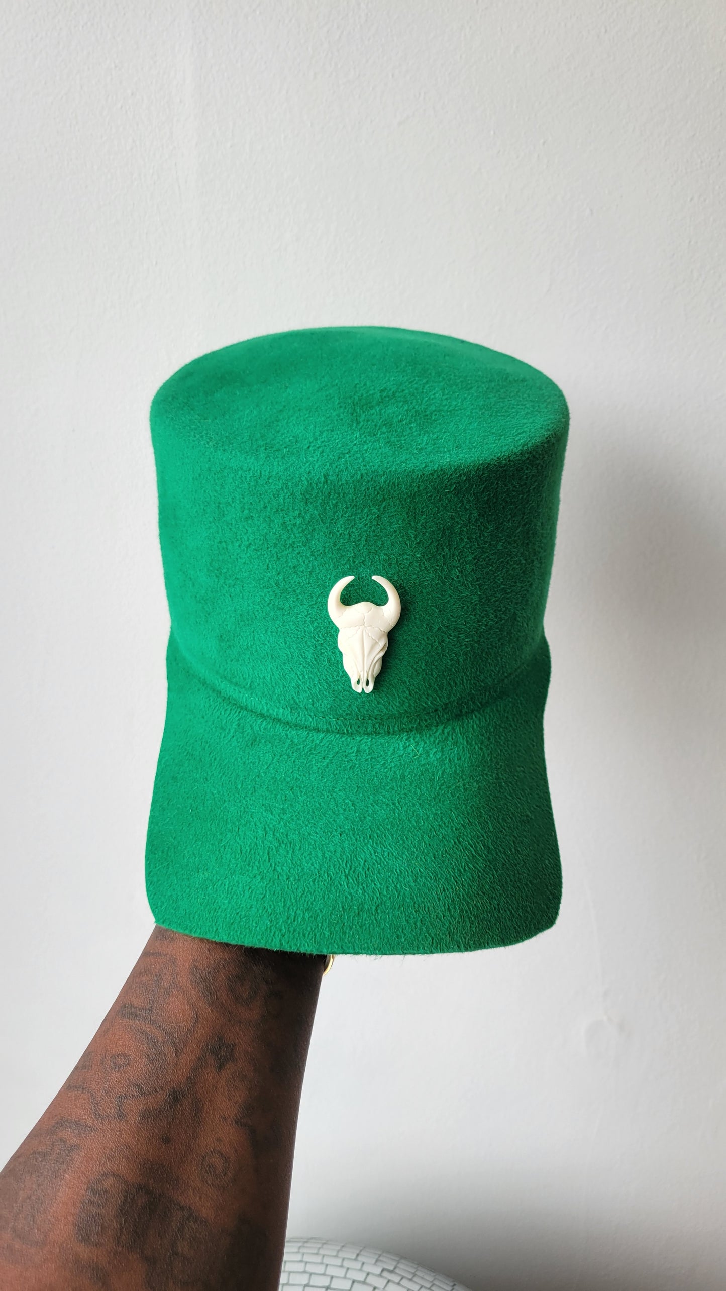 The Rhea Cap in grass green