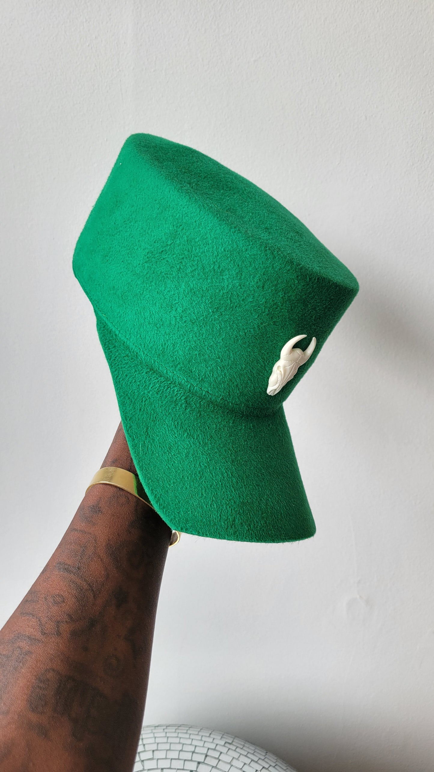The Rhea Cap in grass green