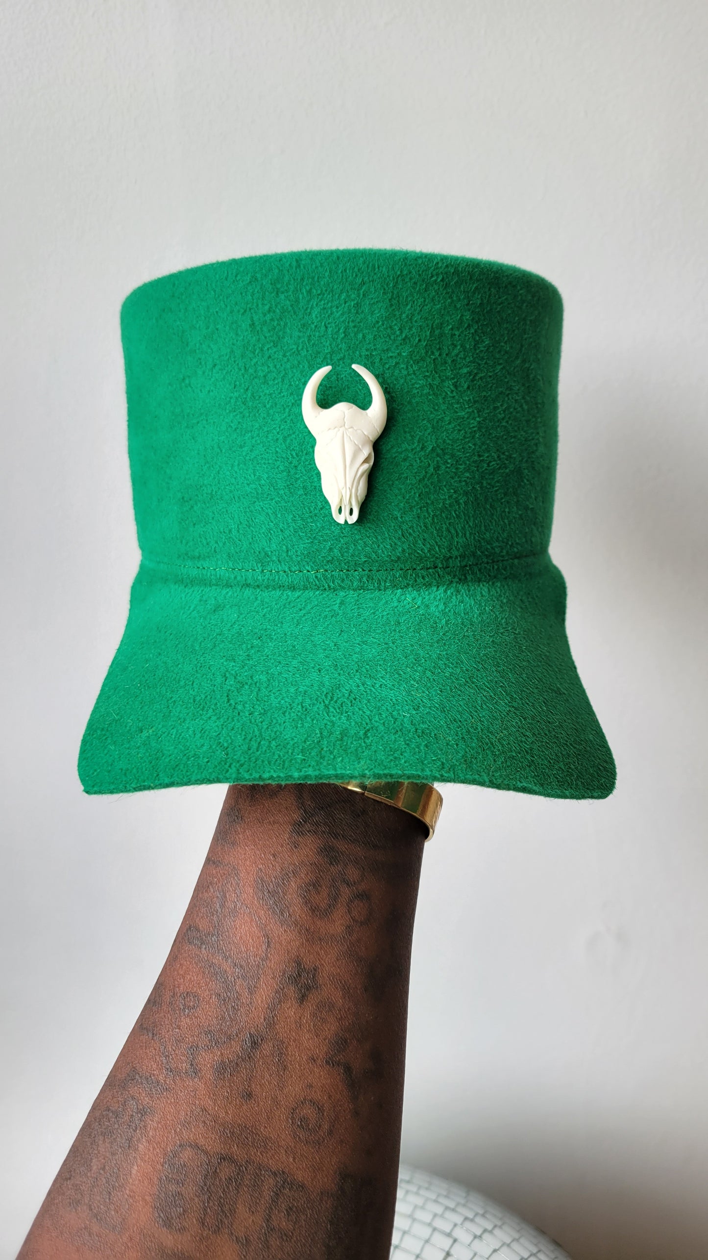The Rhea Cap in grass green