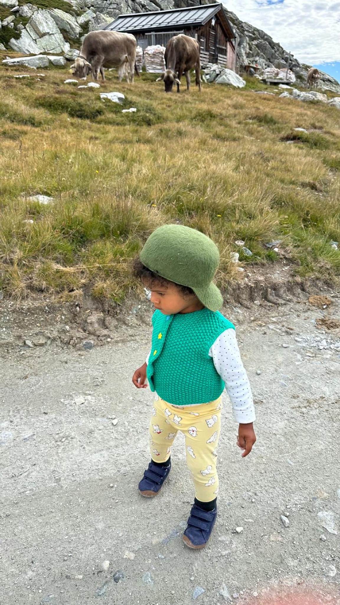 Child wearing an Oliver Lewis hat in the Swiss Alps